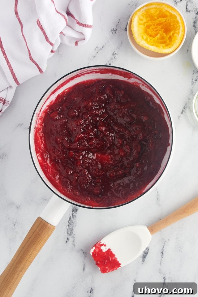 overhead view of homemade cranberry sauce in a saucepan