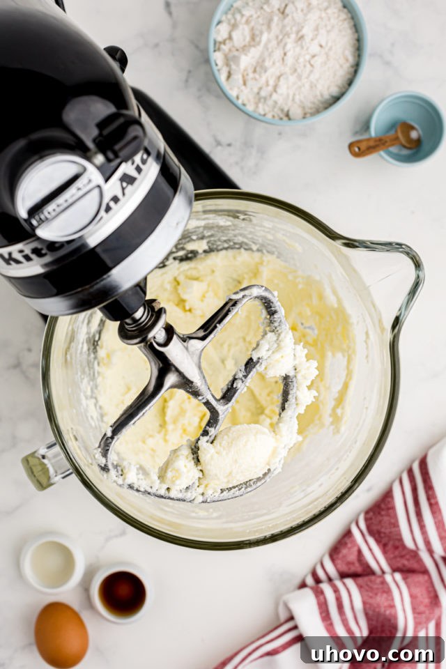 An overhead view of perfectly creamed butter and sugar in the bowl of a stand mixer, lightened in color and fluffy in texture.