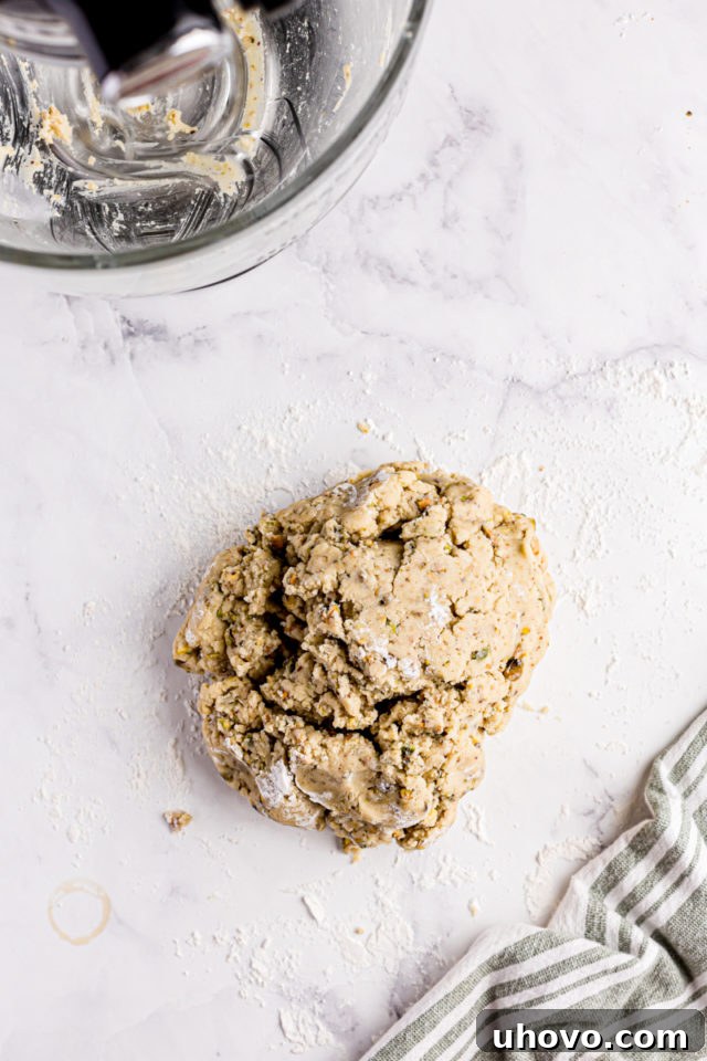 overhead view of pistachio cookie dough on a marble surface