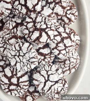overhead view of chocolate crinkle cookies on a white serving tray