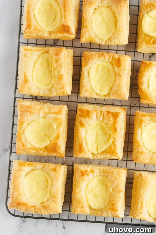 Overhead view of cheese danishes on wire rack