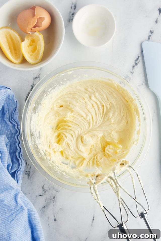 Overhead view of cream cheese filling in mixing bowl