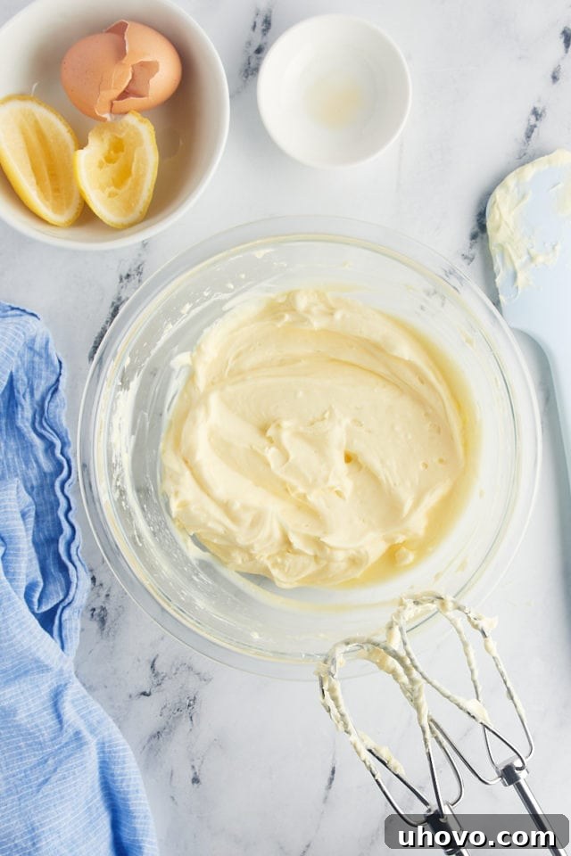 Overhead view of cream cheese filling in mixing bowl