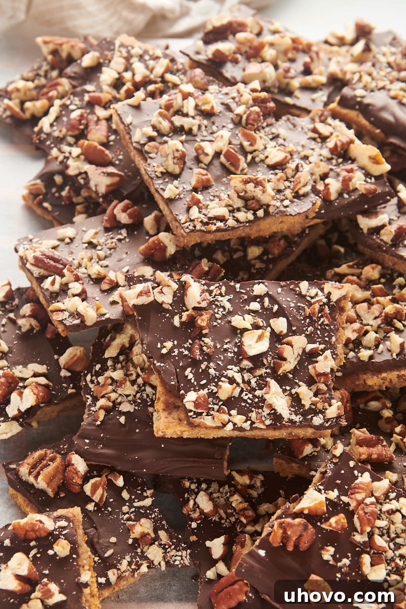 A large, inviting pile of Graham Cracker Toffee pieces, showcasing the delectable layers and textures.