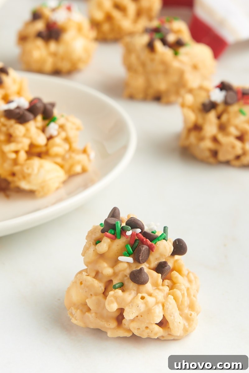 an avalanche cookie on a white countertop with more cookies in the background