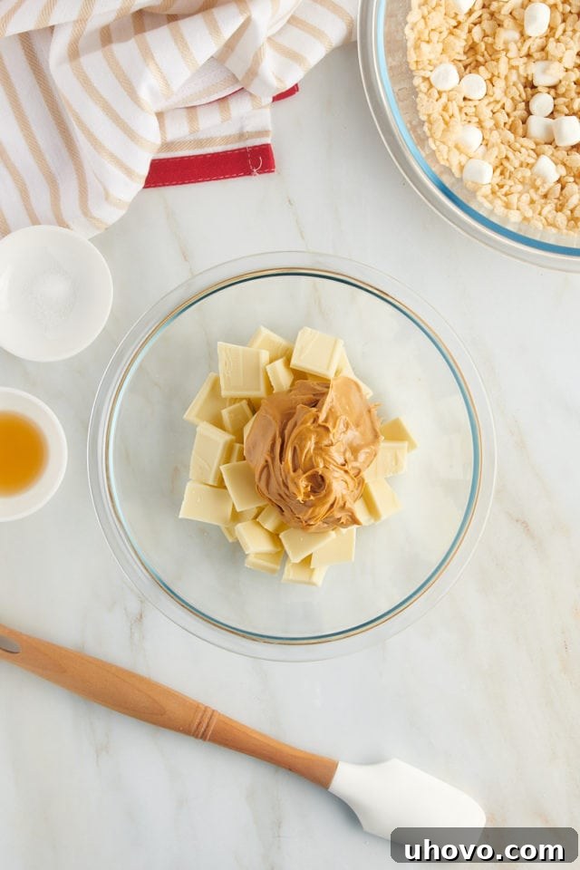 overhead view of white chocolate and peanut butter in a glass bowl