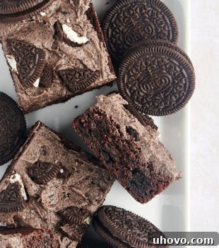 Overhead view of Oreo brownies on tray with whole Oreo cookies