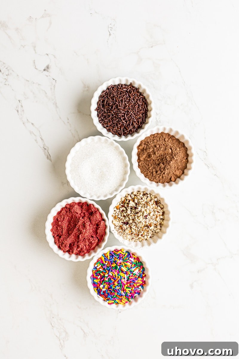 An array of chocolate truffles coated in different toppings, including cocoa powder, colorful sprinkles, crushed nuts, and shredded coconut, showcasing various creative coating ideas.