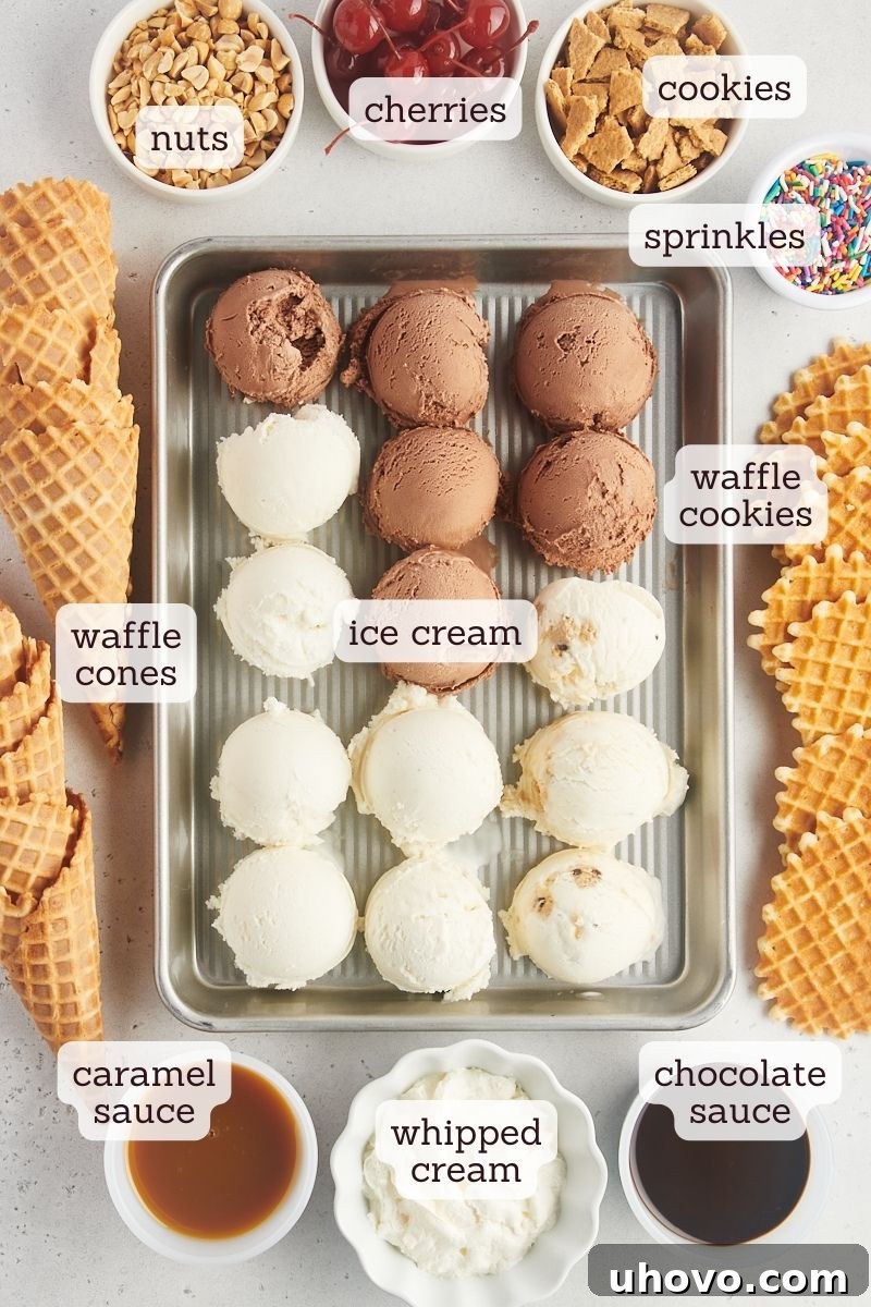 An overhead shot showcasing the key ingredients for ice cream nachos: a selection of colorful ice cream pints, crisp waffle cones, and various toppings in small bowls.