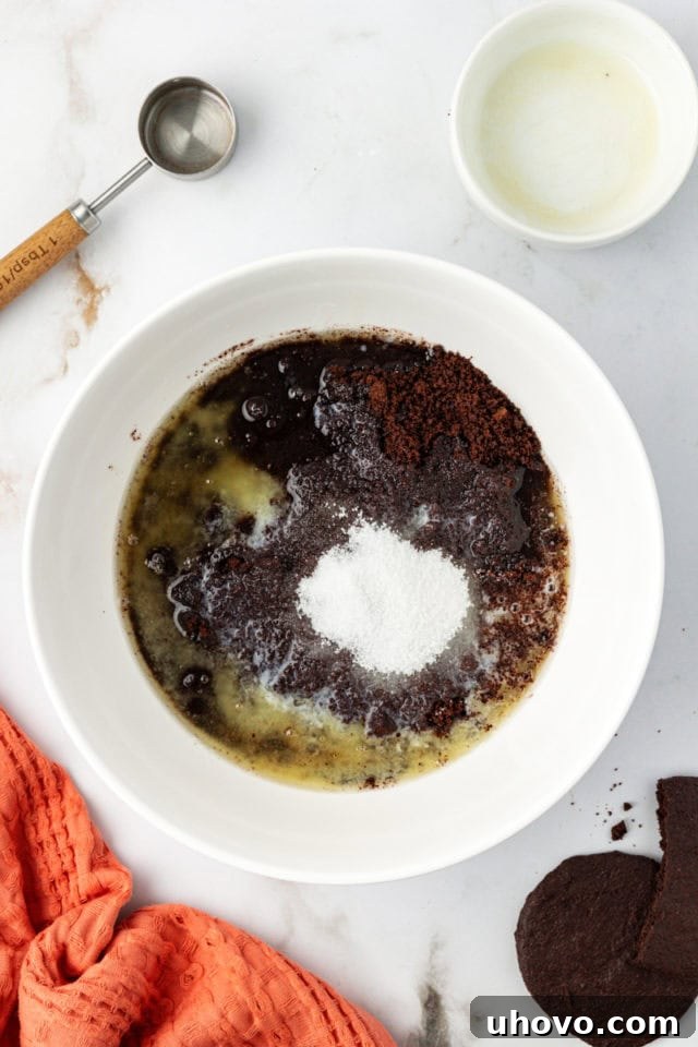 Mixing bowl with ingredients for chocolate cookie crust