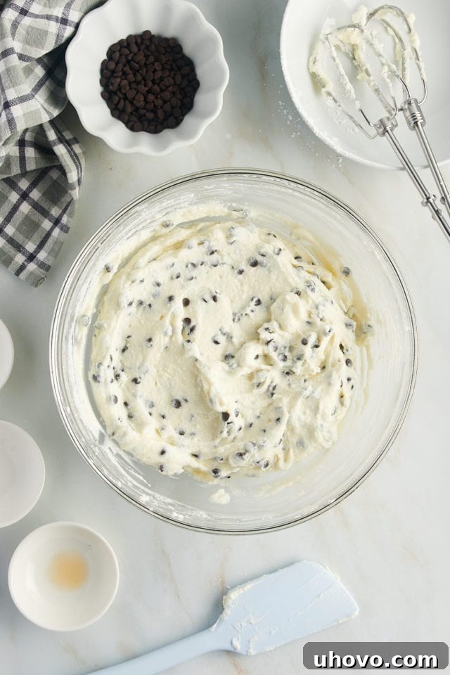 overhead view of cannoli dip in a glass mixing bowl