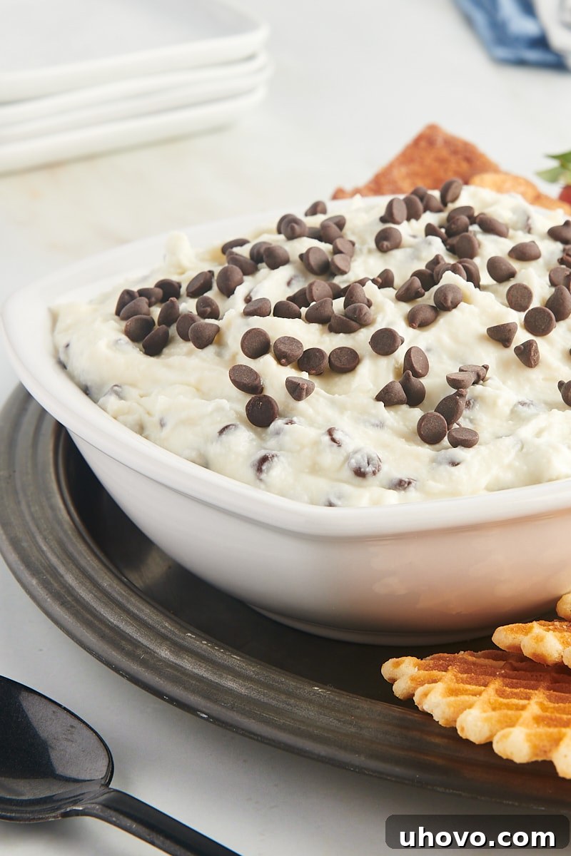 cannoli dip in a white bowl on a pewter tray
