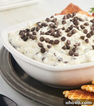 cannoli dip in a white bowl on a pewter tray