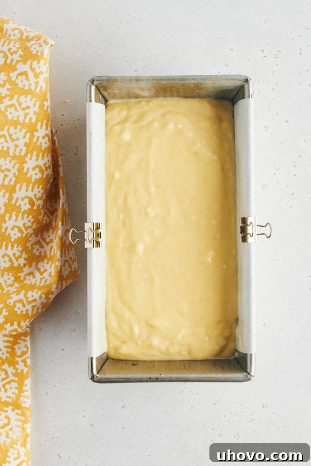 Overhead view of lemon loaf cake batter in pan
