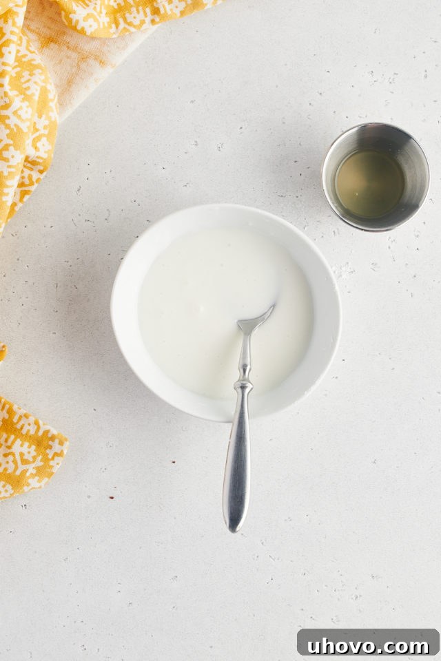 Overhead view of lemon glaze in bowl