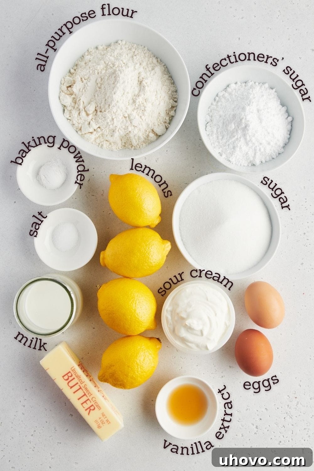 Overhead view of ingredients for lemon loaf cake with labels