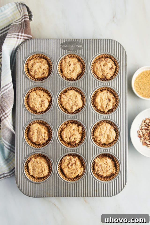 Overhead view of cinnamon pecan muffin batter in pan