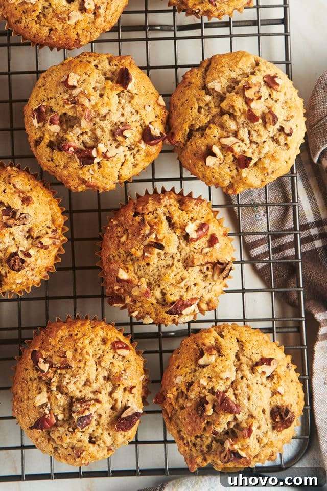 Overhead view of cinnamon pecan muffins on wire rack