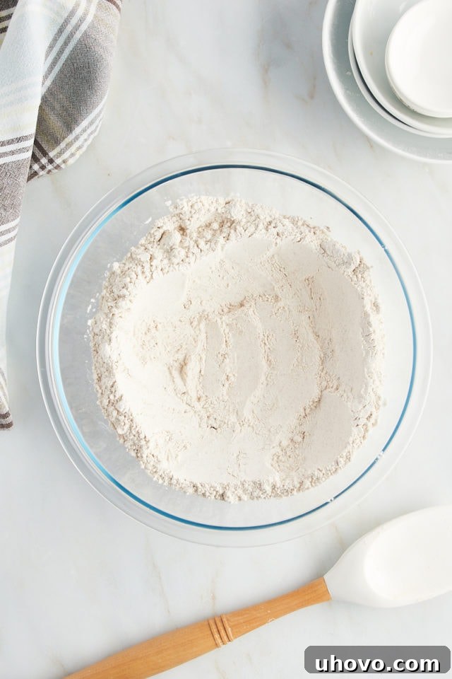 Overhead view of dry ingredients in bowl with well in center