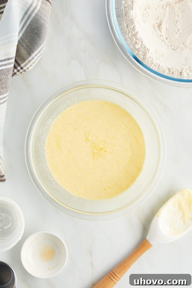 Overhead view of liquid ingredients for muffins in mixing bowl