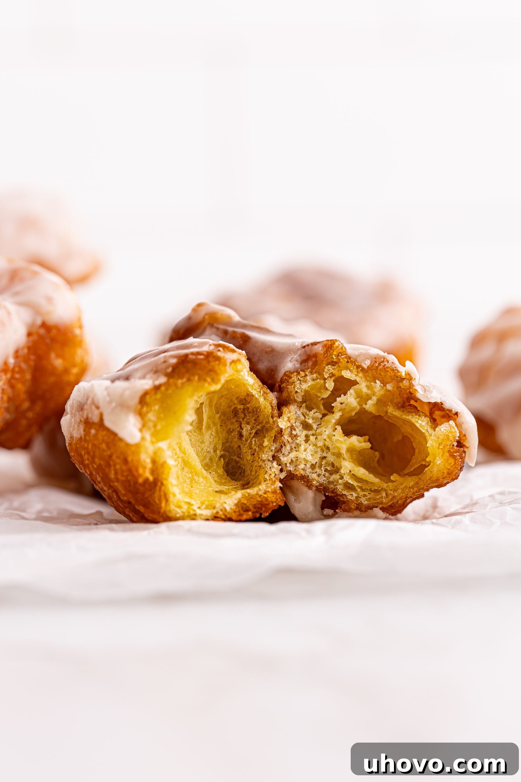 Halved French cruller to show airy interior