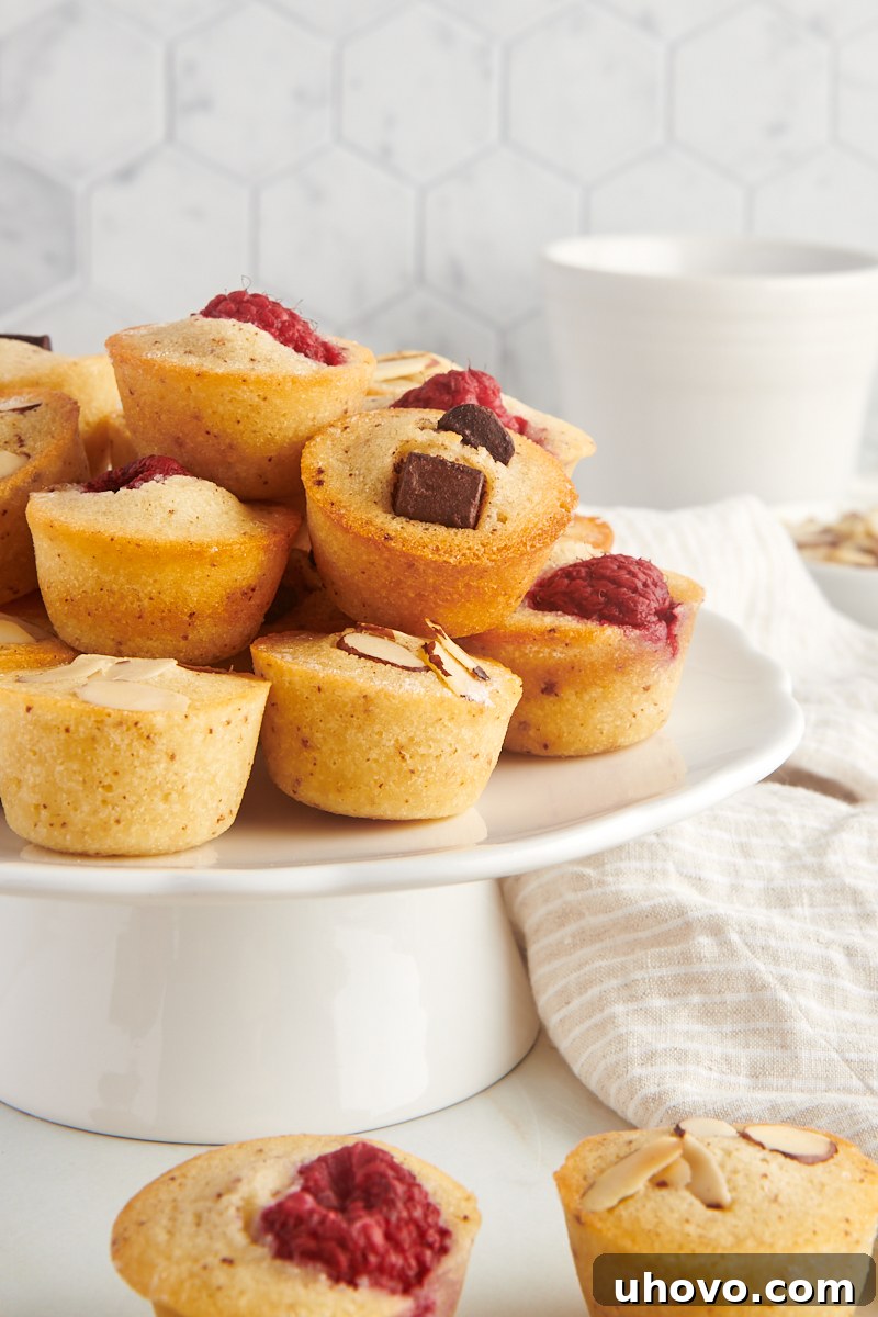 financiers served on a small white cake stand
