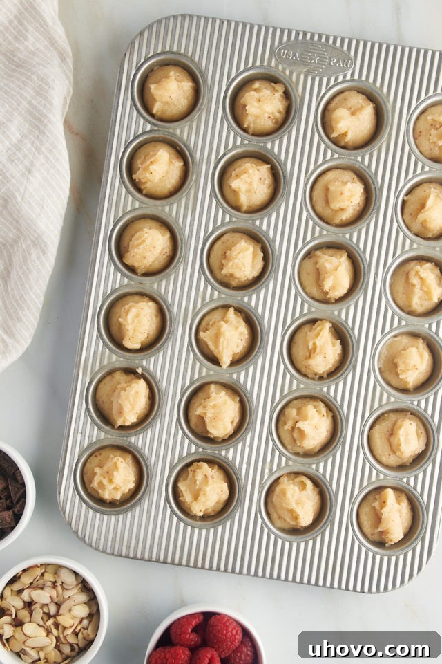 overhead view of financiers batter in a mini muffin pan