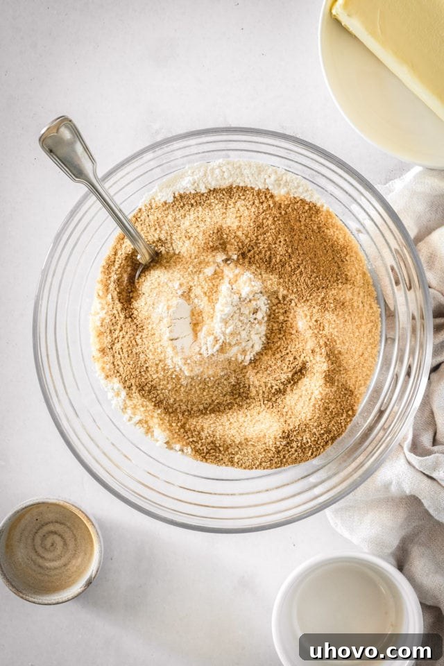 Overhead view of dry ingredients for crumb mixture, neatly combined in a bowl.