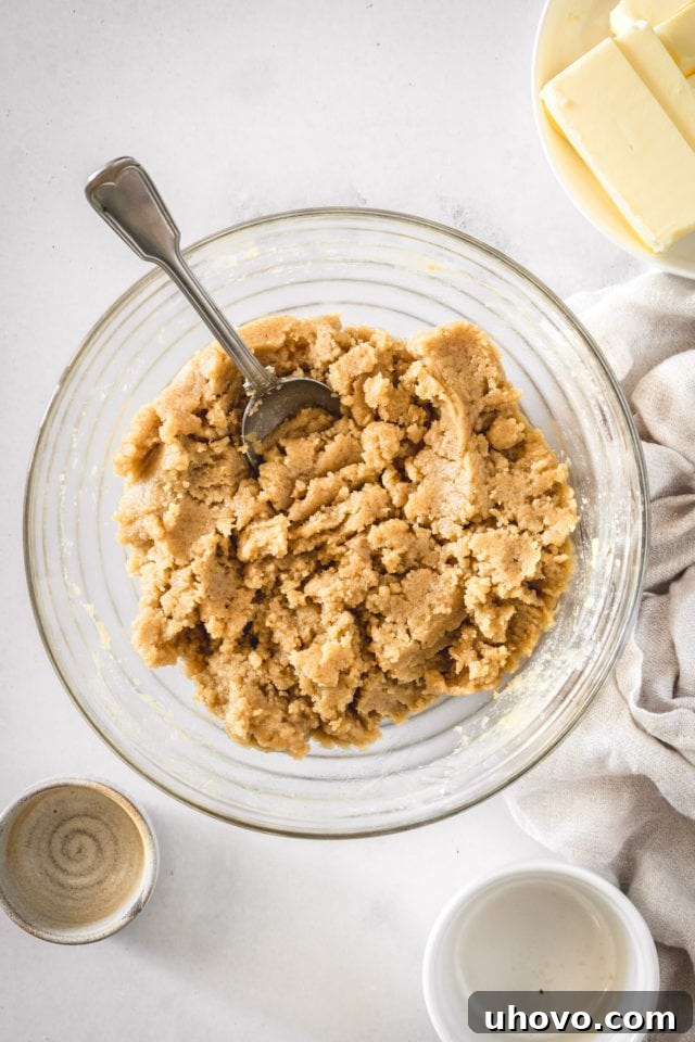 Overhead view of the completed crumb mixture, displaying perfect moist, large clumps ready for the cake.