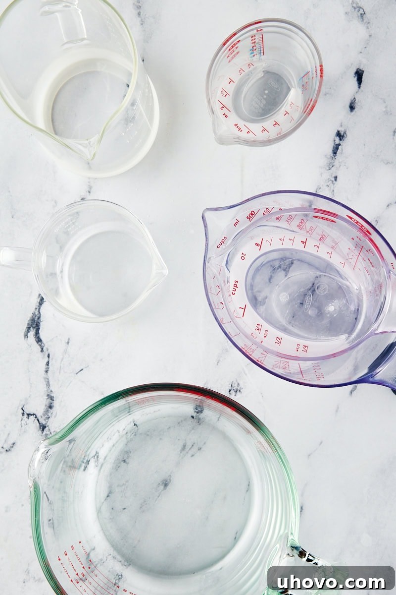 overhead view showcasing various liquid measuring cups in different sizes and materials