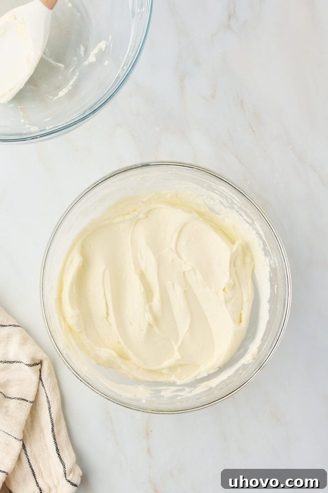 overhead view of mixed s'mores pie filling in a glass mixing bowl