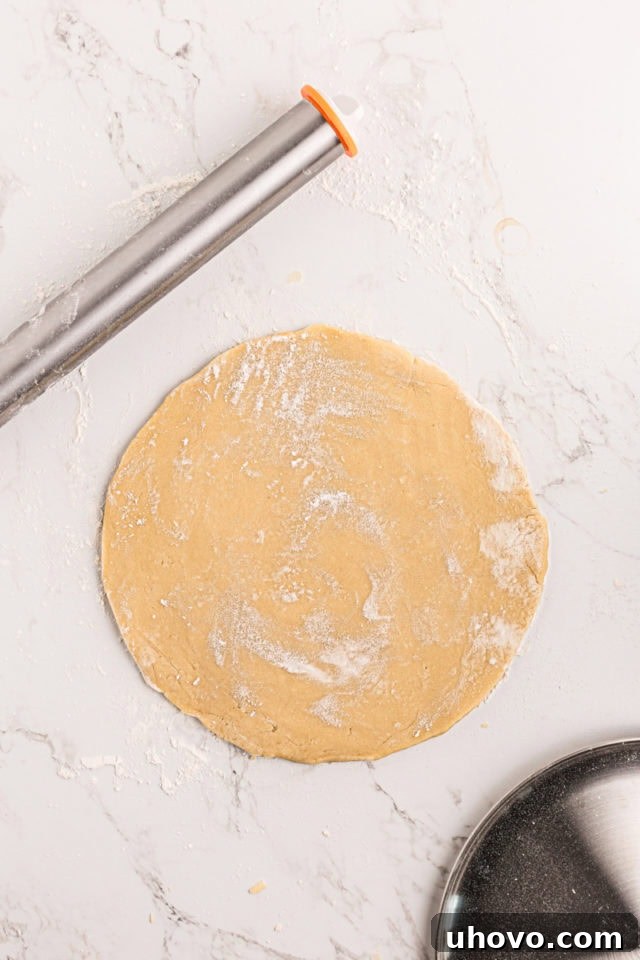 overhead view of rolled sugar cookie crust dough for fruit pizza