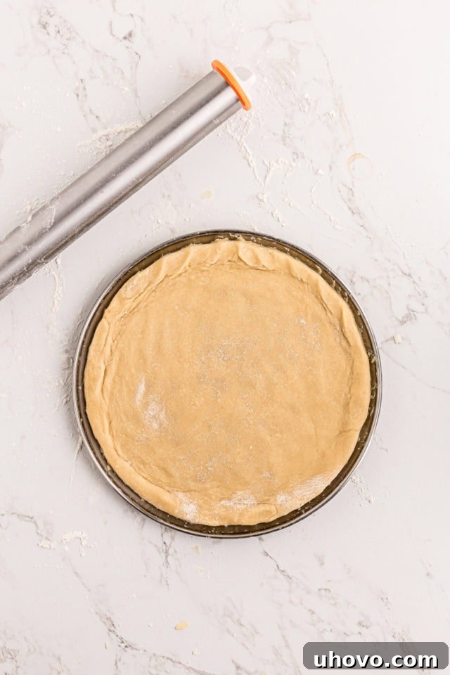 overhead view of sugar cookie crust for fruit pizza on a pizza pan