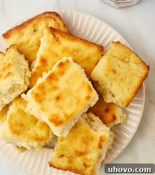 overhead view of butter swim biscuits piled on a plate