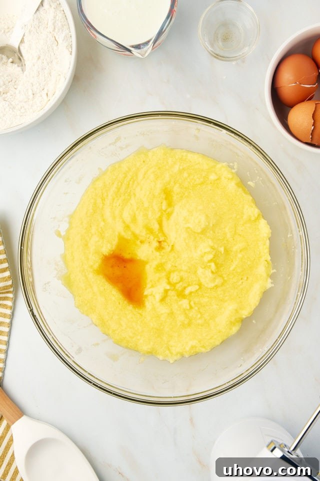 overhead view of vanilla added to wet ingredients for Kentucky butter cake