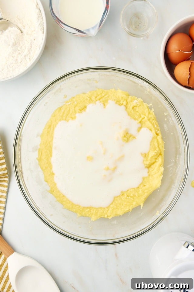 overhead view of buttermilk added to Kentucky butter cake batter