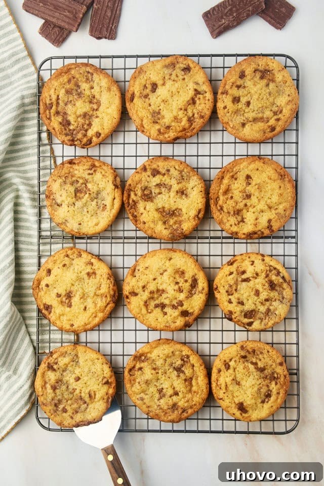Heath bar cookies arranged neatly on a wire cooling rack.