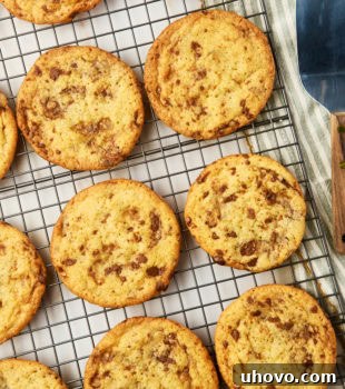 Overhead view of Heath bar cookies cooling on wire rack, with a rich golden-brown color.