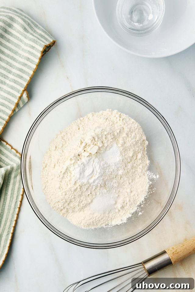 Dry ingredients in a mixing bowl, ready to be whisked together.