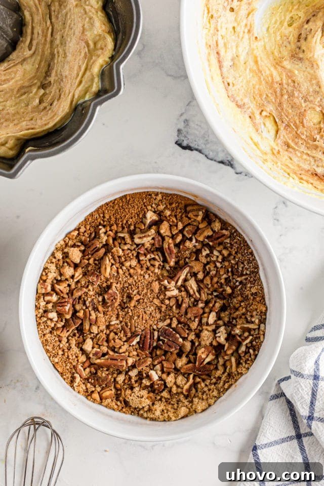 A bowl filled with a rich brown sugar and cinnamon mixture, prepared and ready to be spread into a Bundt cake.