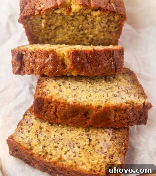 partially sliced banana bread on a cutting board