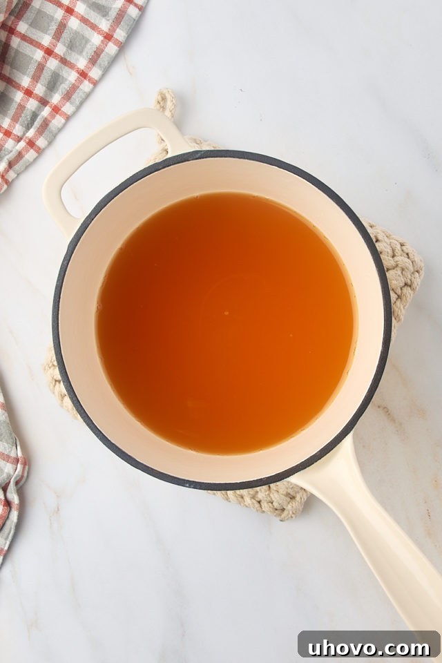 overhead view of apple cider in a saucepan