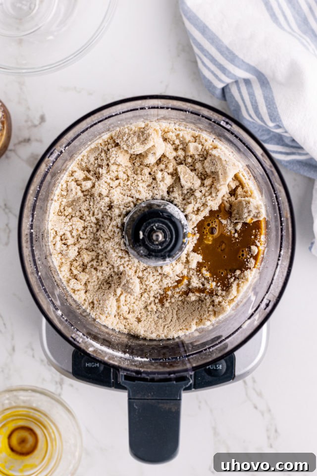 Overhead view of ingredients for tart crust in food processor