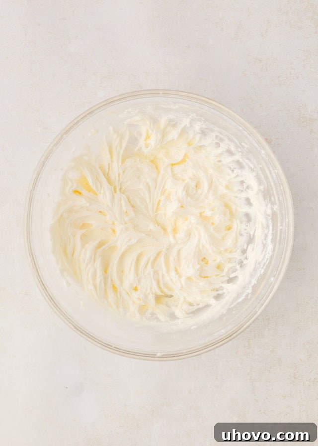 Overhead view of the finished creamy peppermint frosting in a mixing bowl, showing its thick yet spreadable consistency.