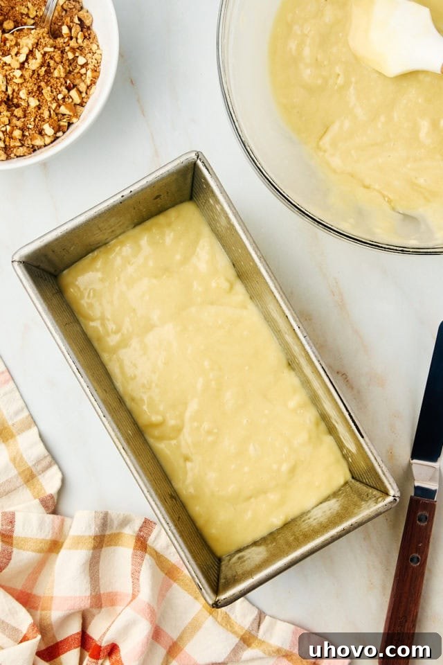 overhead view of cinnamon swirl bread batter in a loaf pan