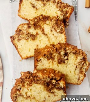 overhead view of four slices of cinnamon swirl bread on parchment paper