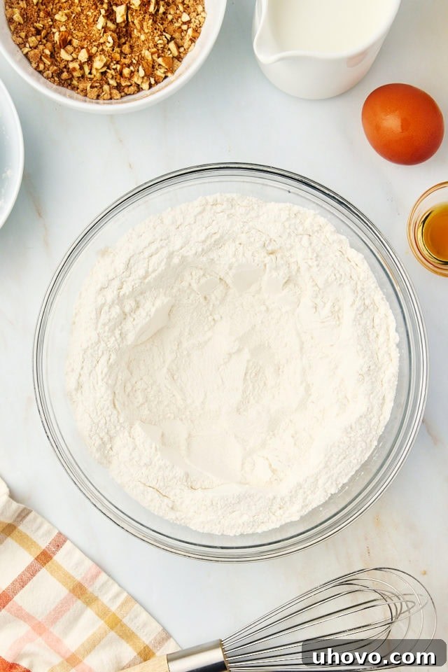 overhead view of mixed dry ingredients with a well made in the center