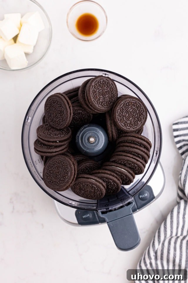 Overhead view of Oreo cookies in the bowl of a food processor, ready to be crushed.