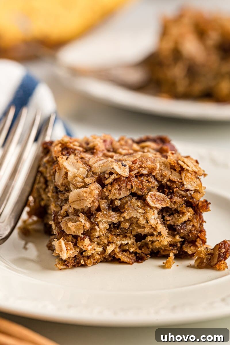 Square of banana oatmeal crumb cake on plate