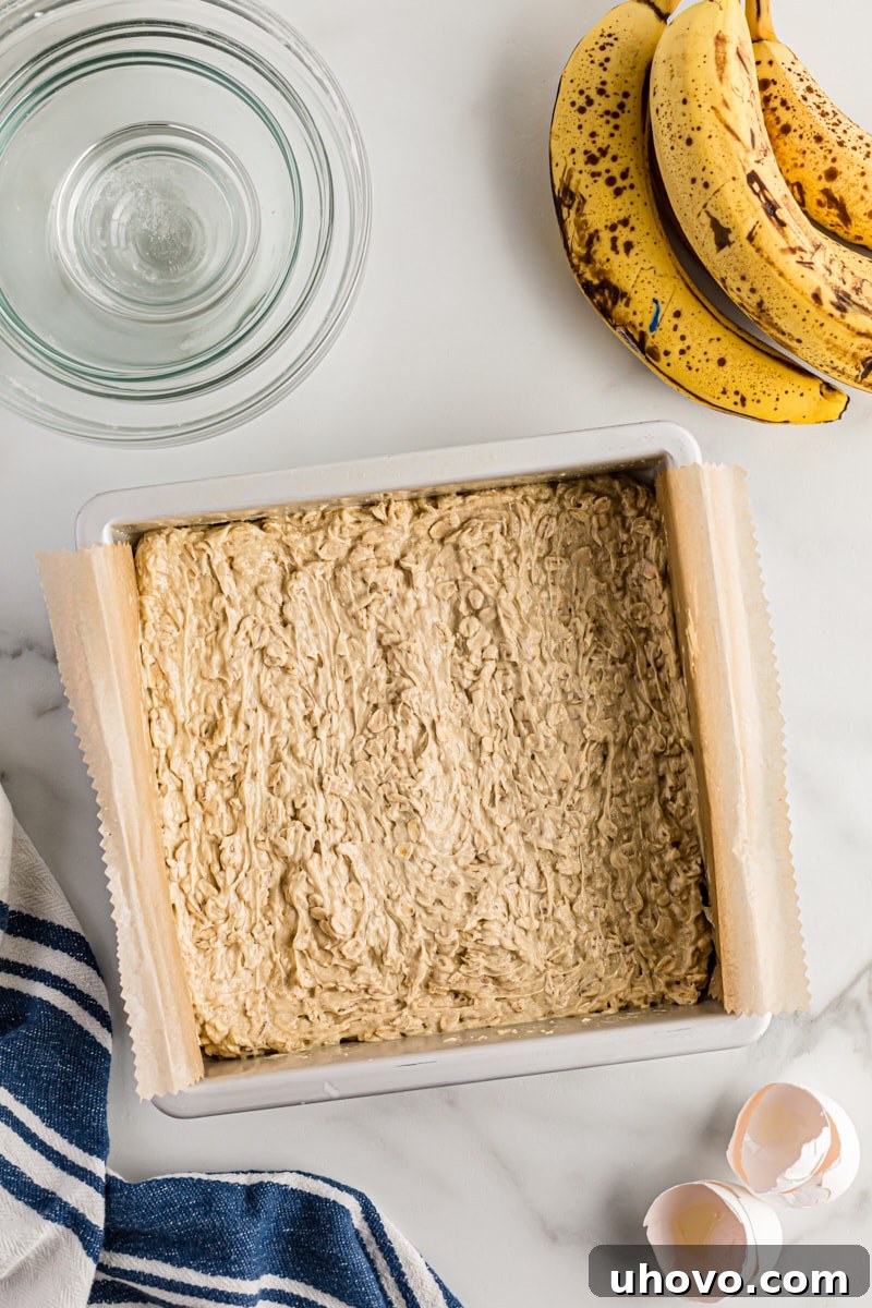 Overhead view of cake batter in square pan
